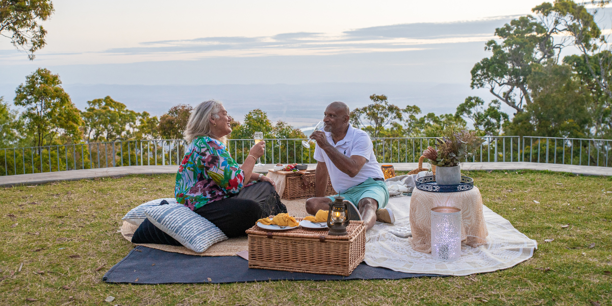 Retired couple having a picnic at Mount Archer (Nurim) amphitheatre. 