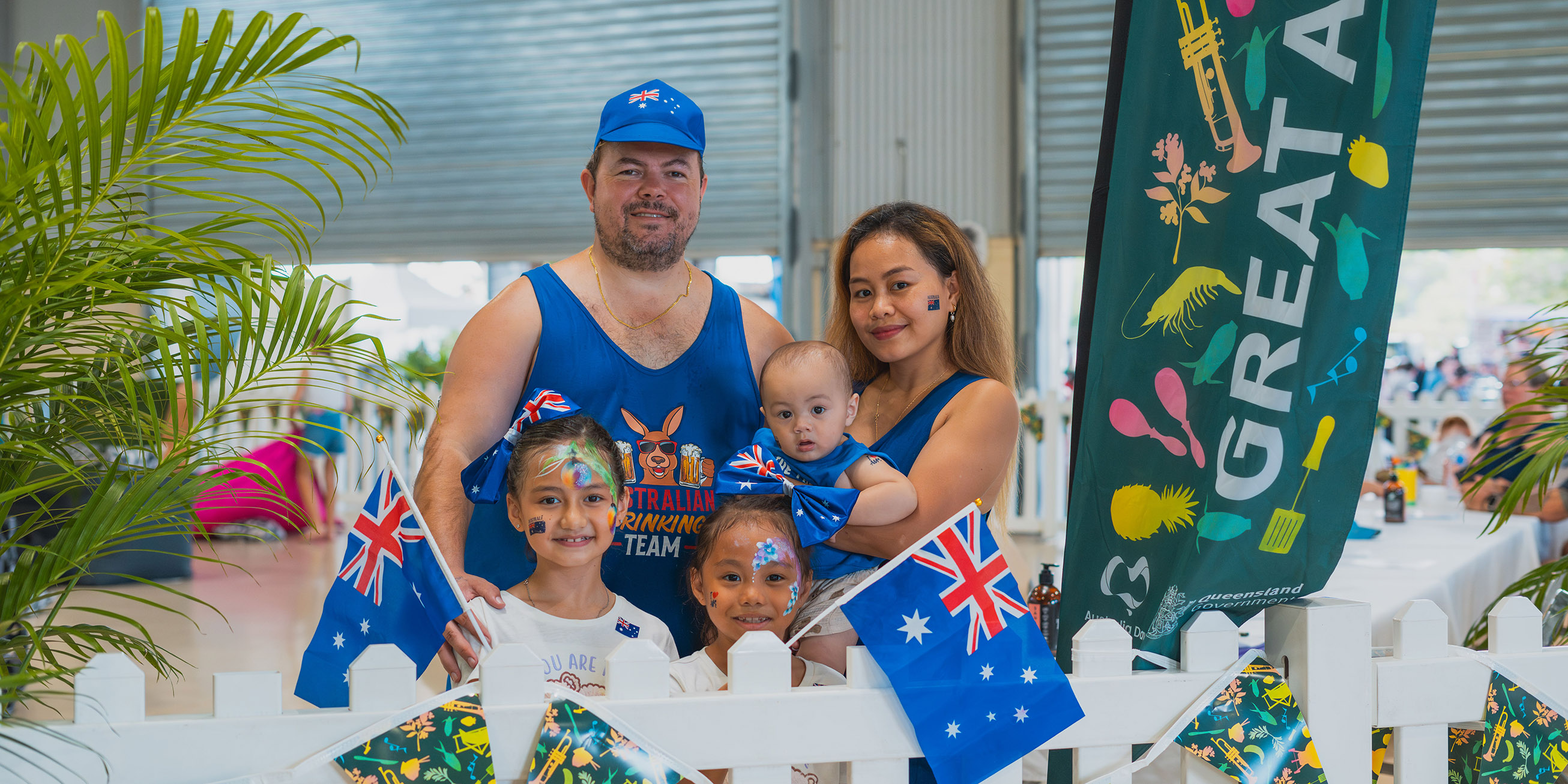 Multicultural family smiling while celebrating Australia Day.