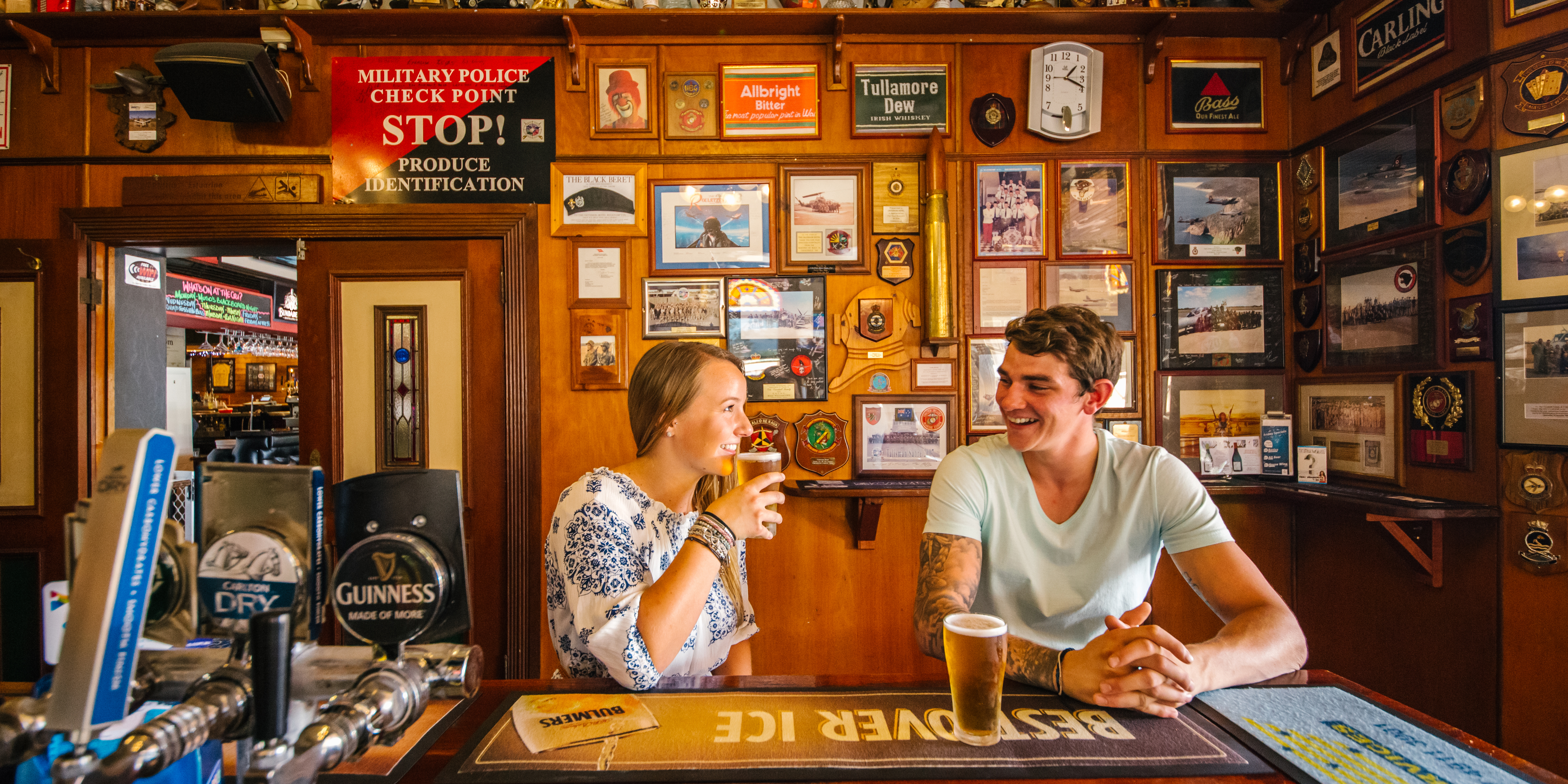 Two people enjoying a beer at the Criterion Hotel