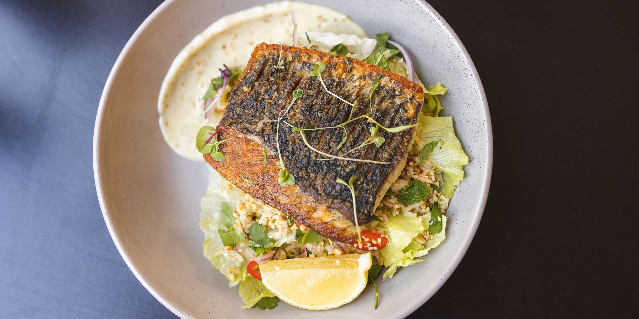 Food served up on a plate with restaurant in the background