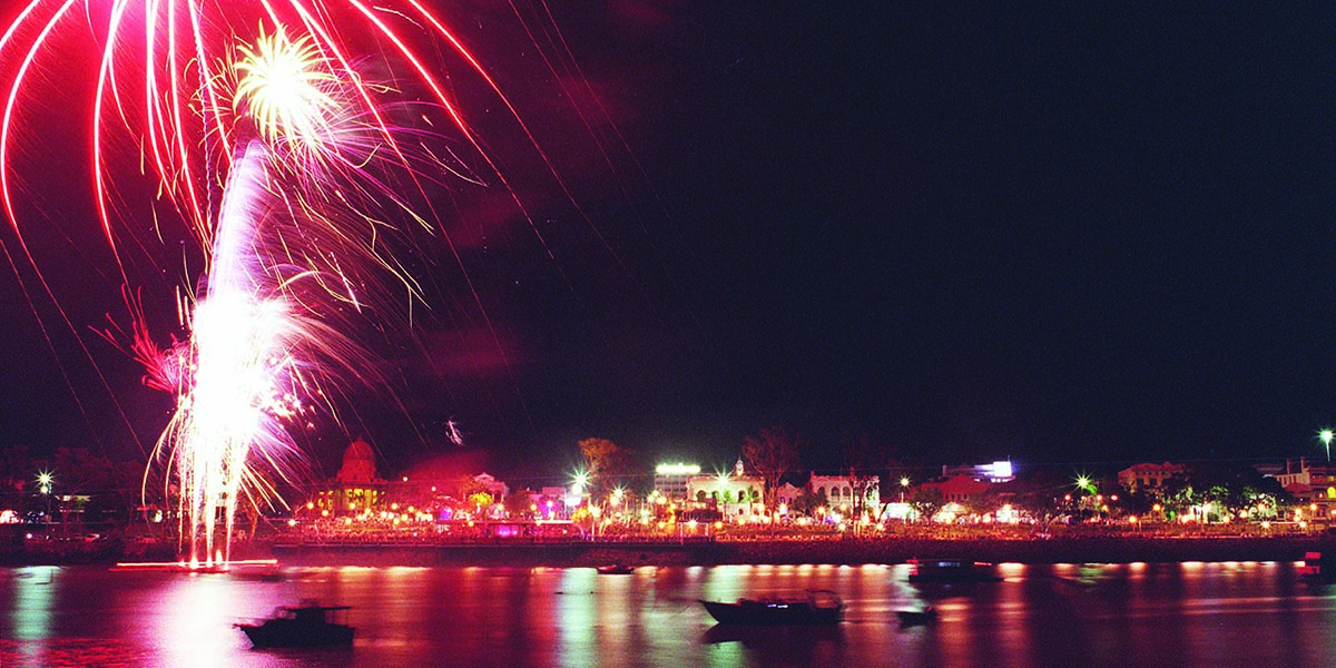 Fireworks lighting up the historic Quay Street buildings and riverbank of Rockhampton.