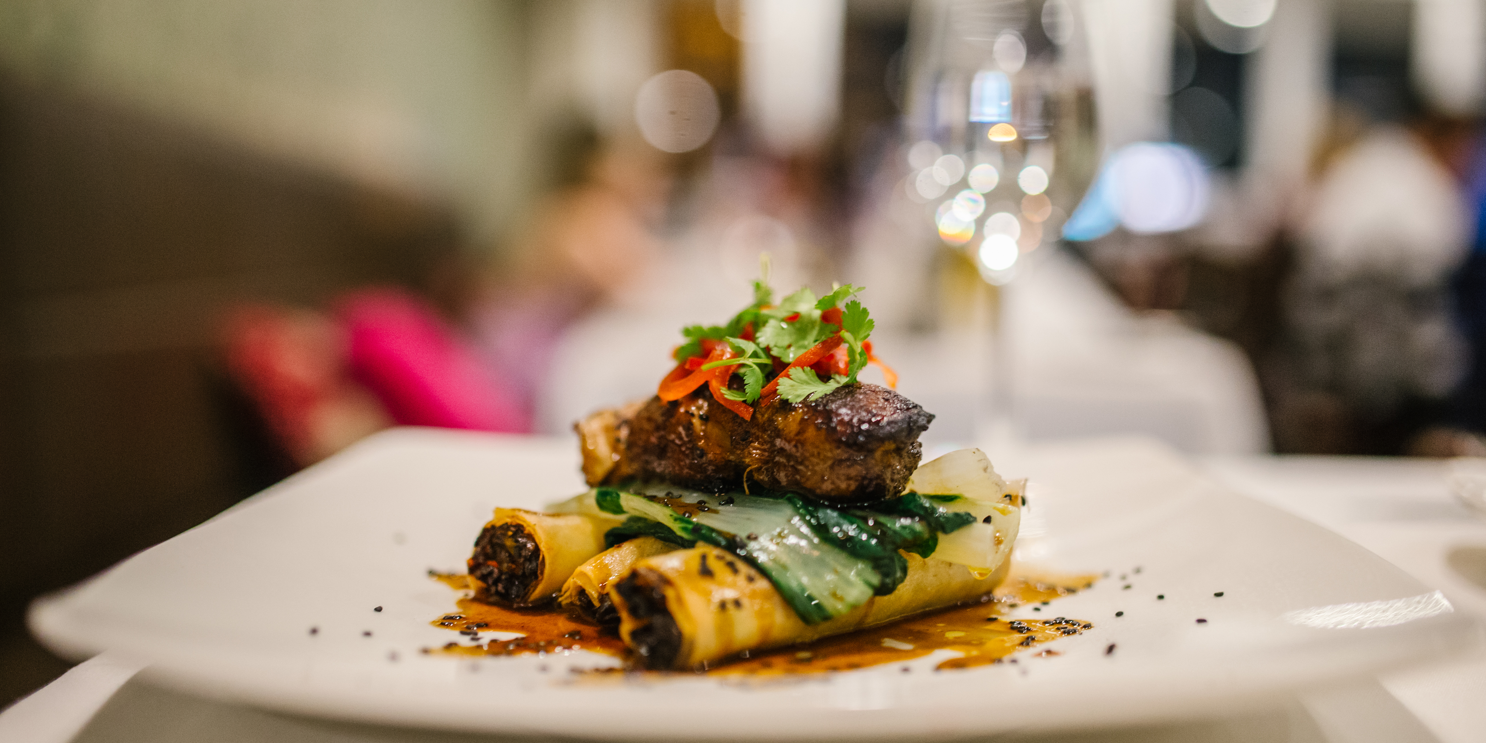 Food served up on a plate with restaurant in the background