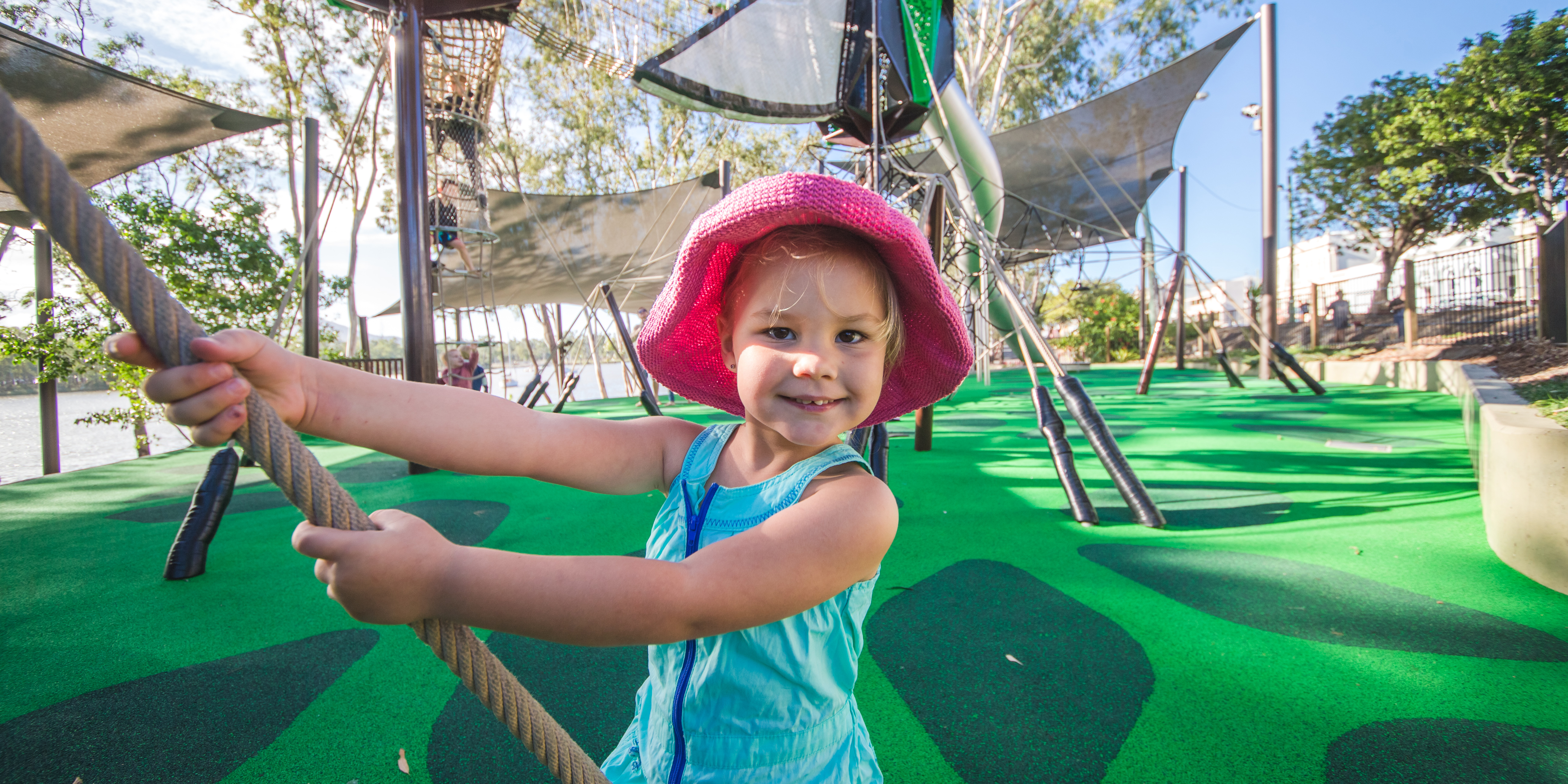 Young girl on a playground smiling