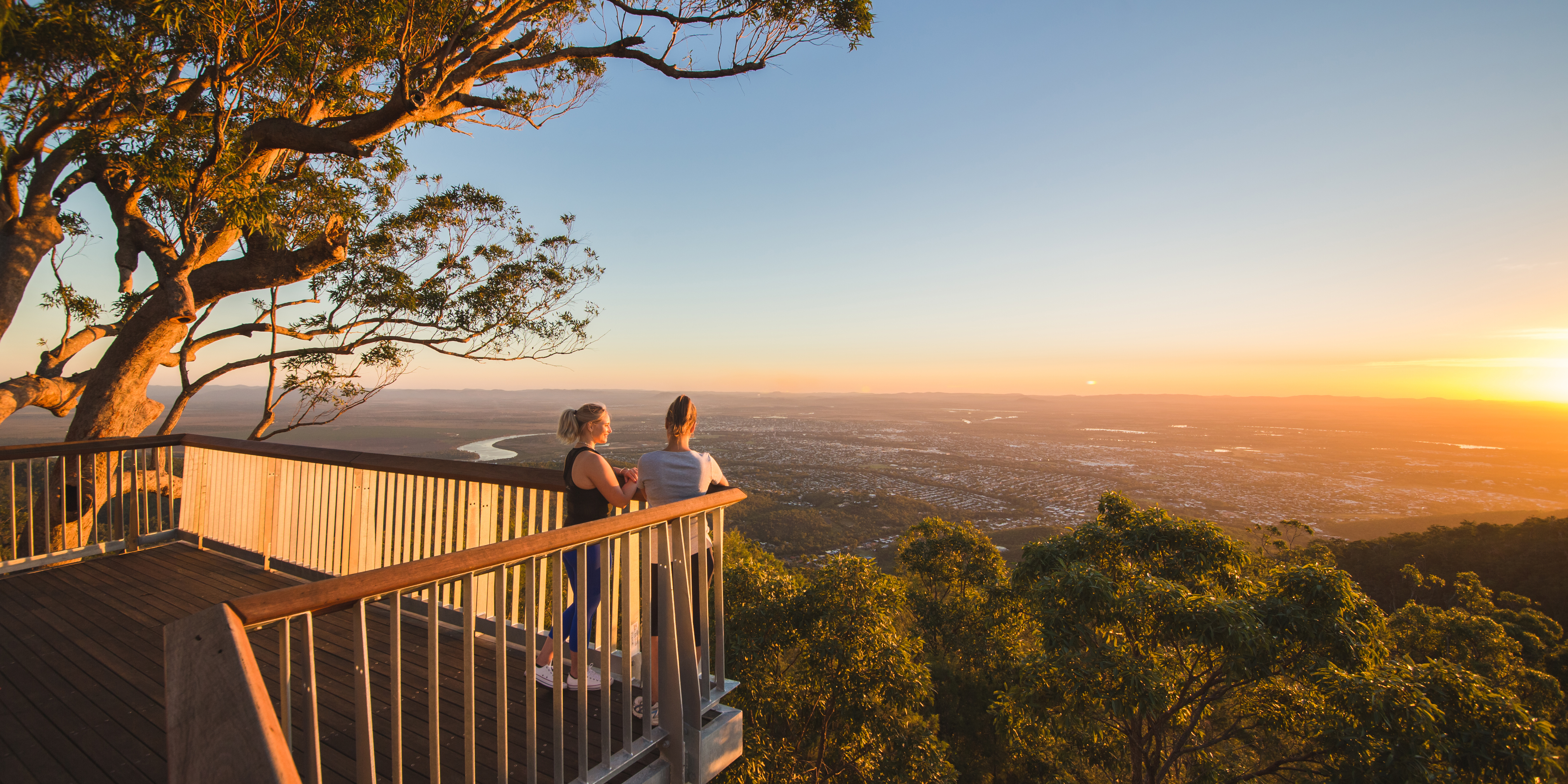 Two young women overlooking Rockhampton city from Mt Archer